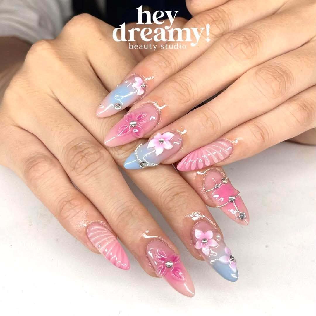 Pink and blue floral nails with delicate silver details by Hey Dreamy