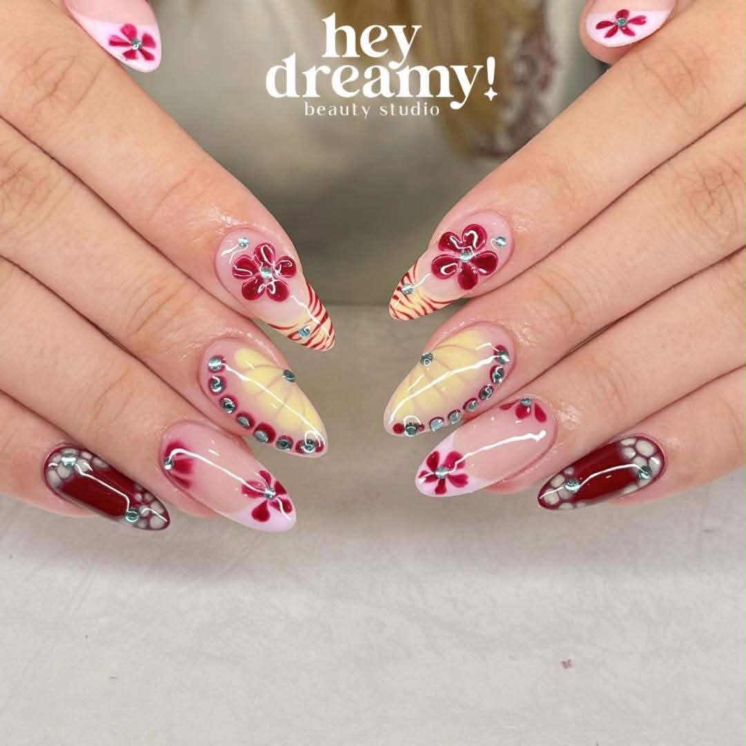 Red flowers, pink and yellow nail art with silver accents by Hey Dreamy