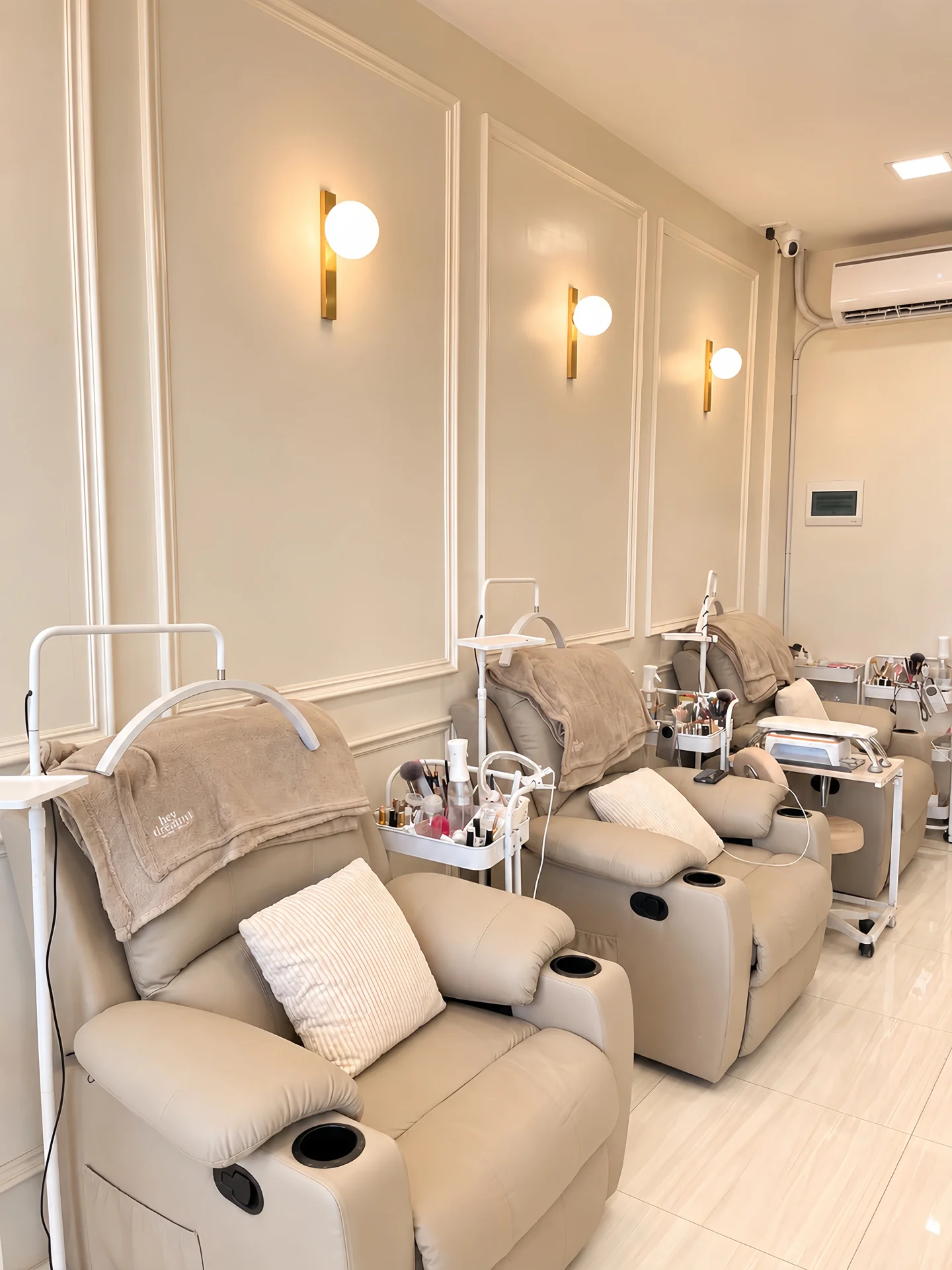 Hey Dreamy Marigondon, Lapu Lapu City: soft neutral salon chairs beneath warm globe lights